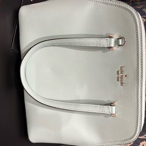 Beautiful Kate Spade bag, shoulder strap still wrapped in foam. Used only once.